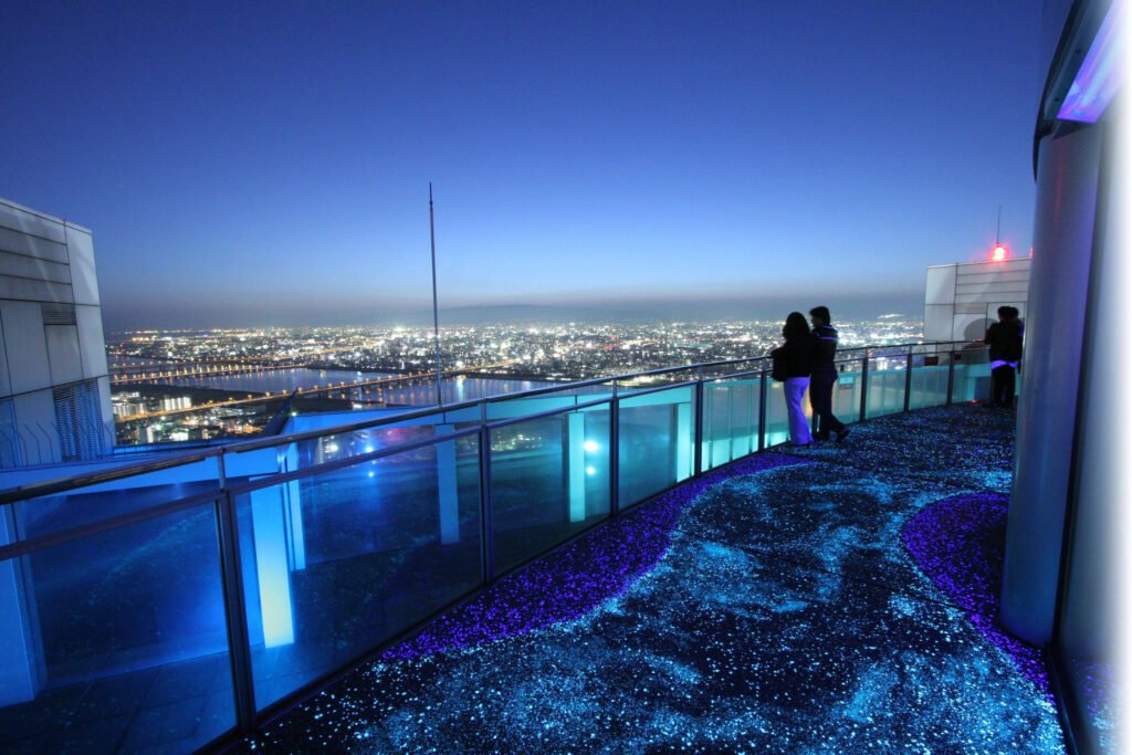 Panoramic Osaka skyline at sunset viewed from the Umeda Sky Building observatory