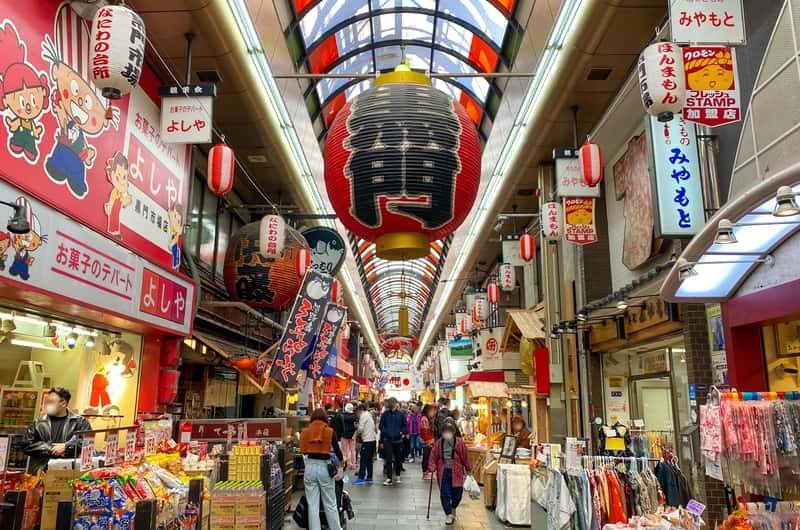 Entrance and covered shopping street of Kuromon Ichiba Market in Osaka, Japan