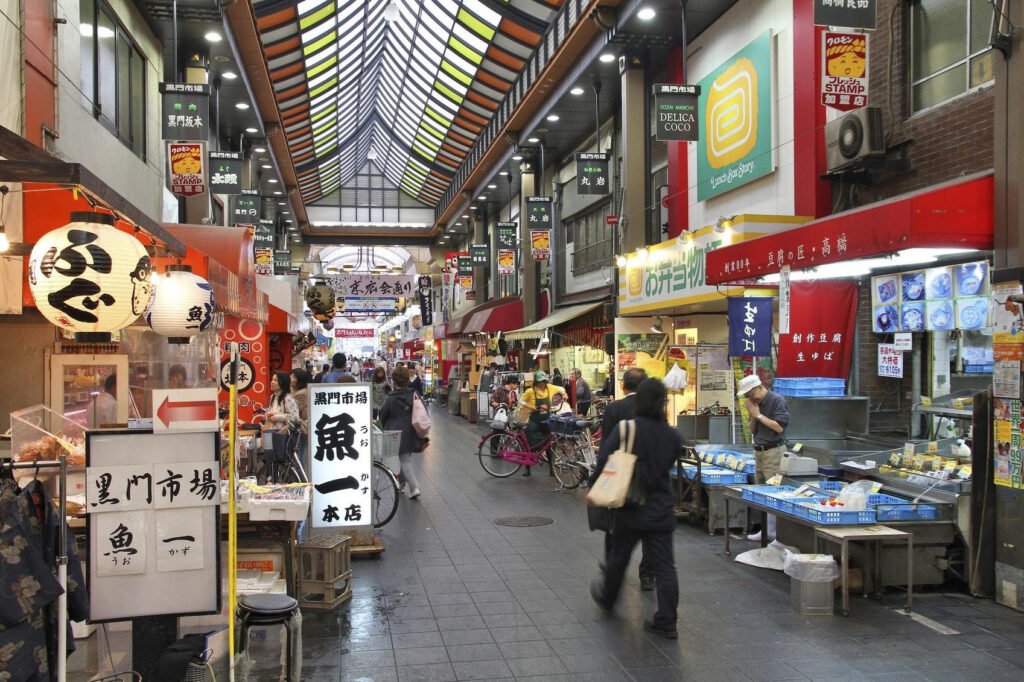 Fresh seafood displayed at a food stall inside Kuromon Ichiba Market in Osaka