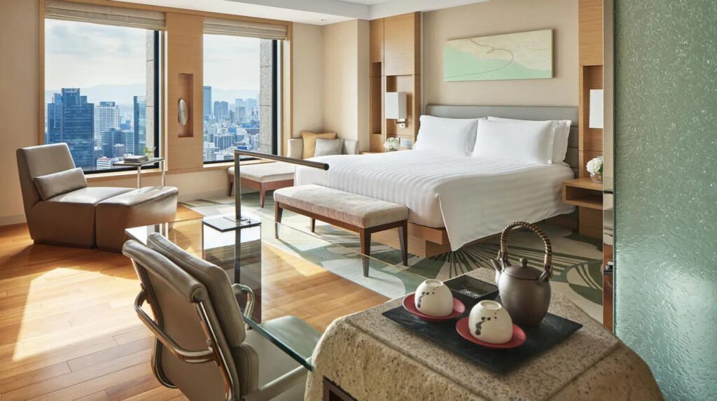 Luxury guest room with panoramic city views at Conrad Osaka hotel