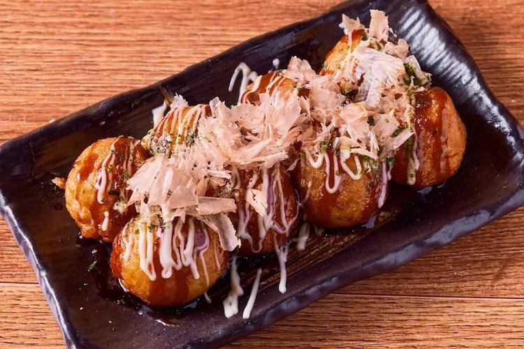 Fresh Osaka takoyaki topped with sauce mayonnaise and bonito flakes