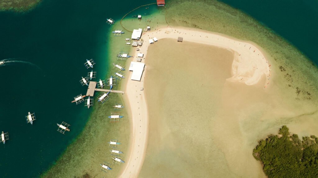 Beautiful sandbar and clear turquoise water at Luli Island in Puerto Princesa