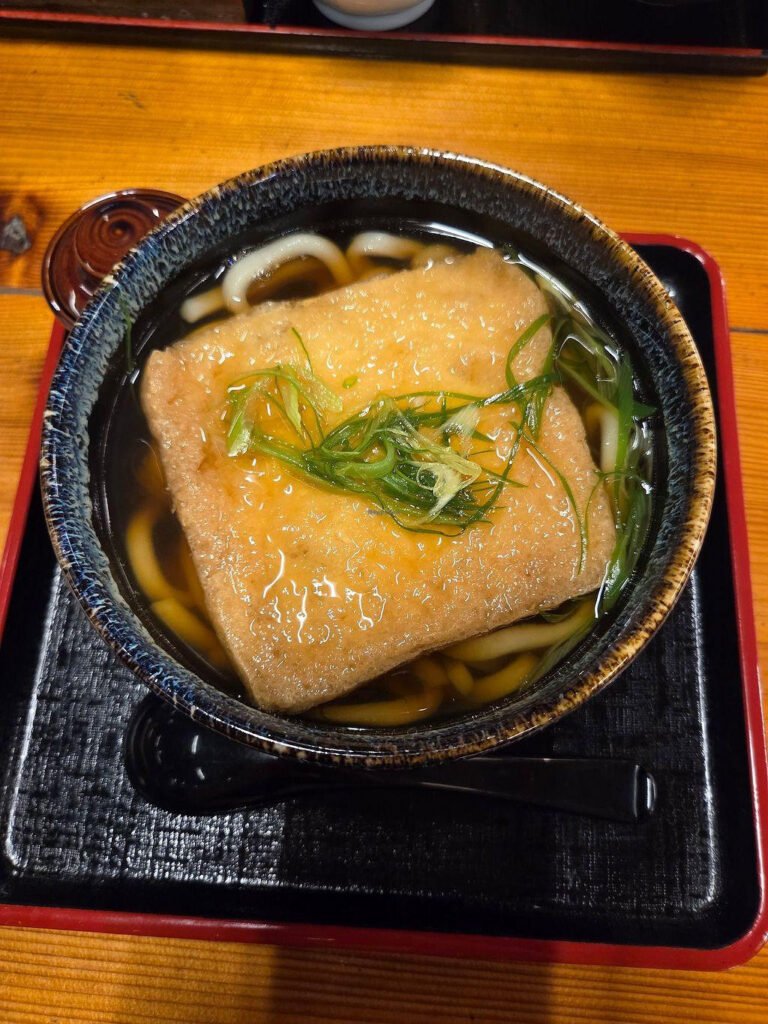 Kyoto-style kitsune udon with fried tofu and Kujo green onions in Japan