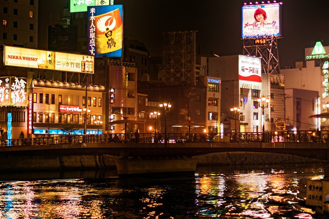 Nakasu riverfront and central Fukuoka illuminated at night