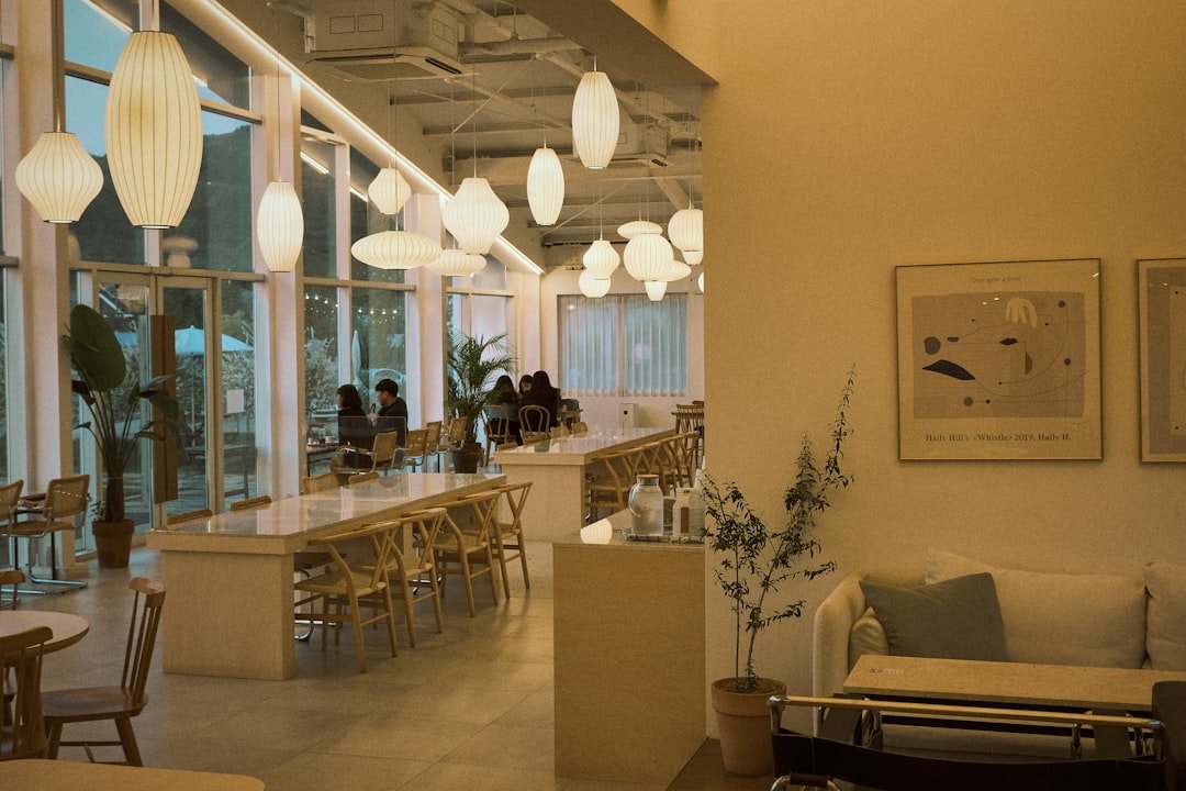 Illustrative quiet Japanese cafe interior with wooden tables and chairs