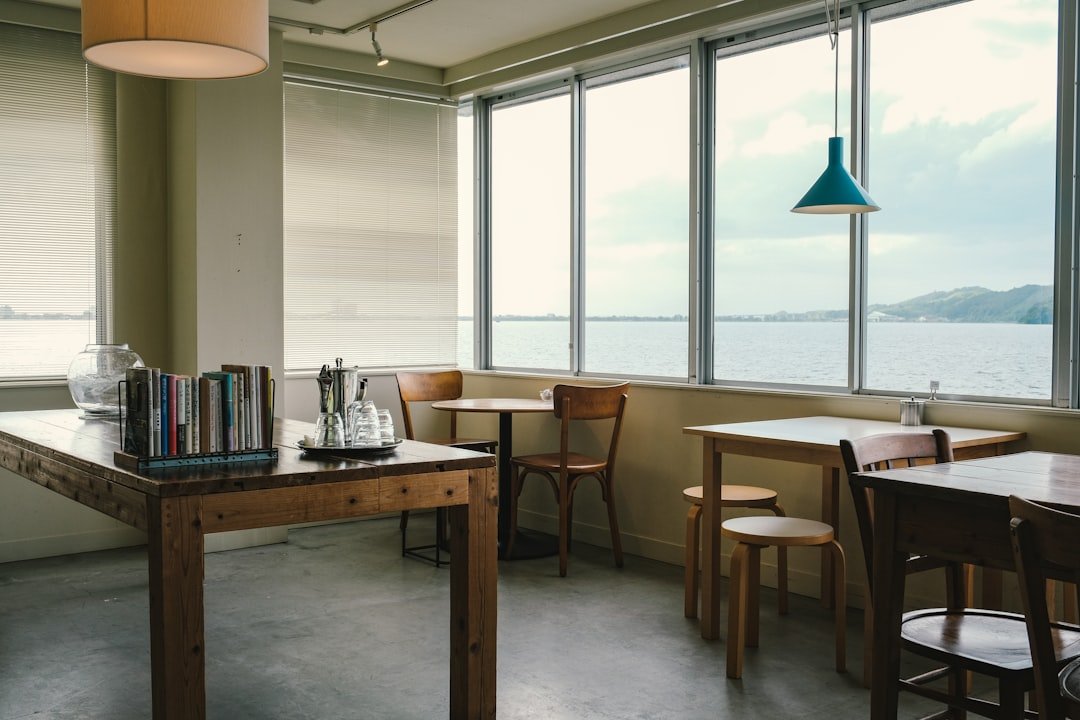 Illustrative bright Japanese cafe interior with large windows