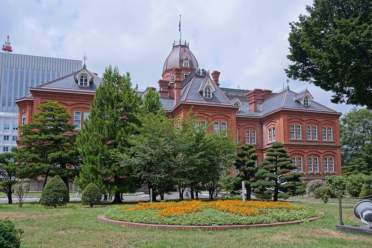 Former Hokkaido Government Office red-brick facade and gardens in July 2025.