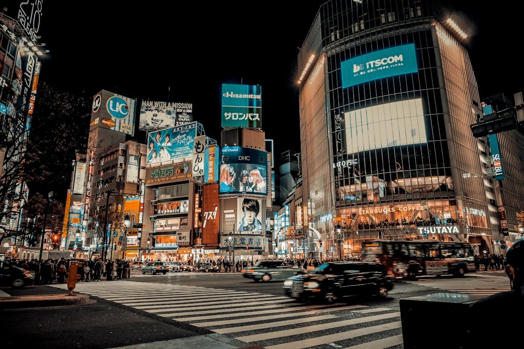Shibuya Scramble Crossing and illuminated buildings at night