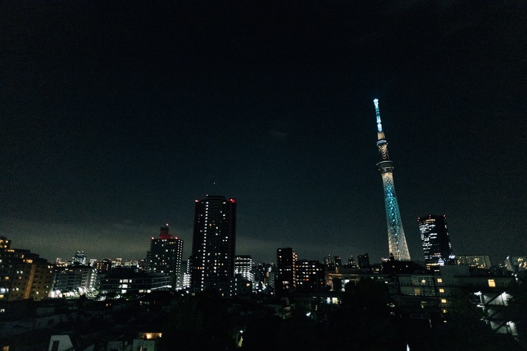 Tokyo Skytree visible above the city at night