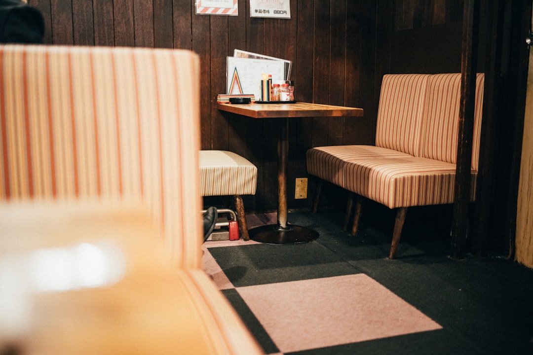 Illustrative compact Tokyo lodging room with a table and chair