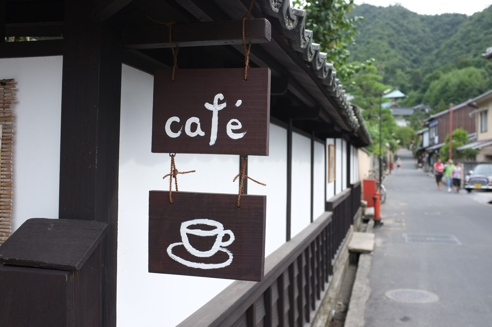 Archival cafรฉ frontage along a street on Miyajima